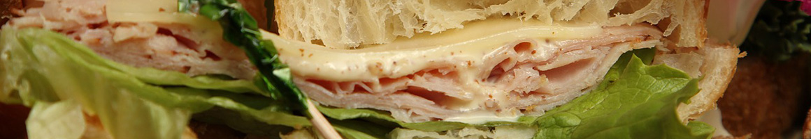 Eating Deli Sandwich at Brown Bag A Sandwich Shoppe And More restaurant in Palm Desert, CA.